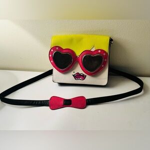 Sweet Betsy Johnson, blonde girl with sunglasses handbag